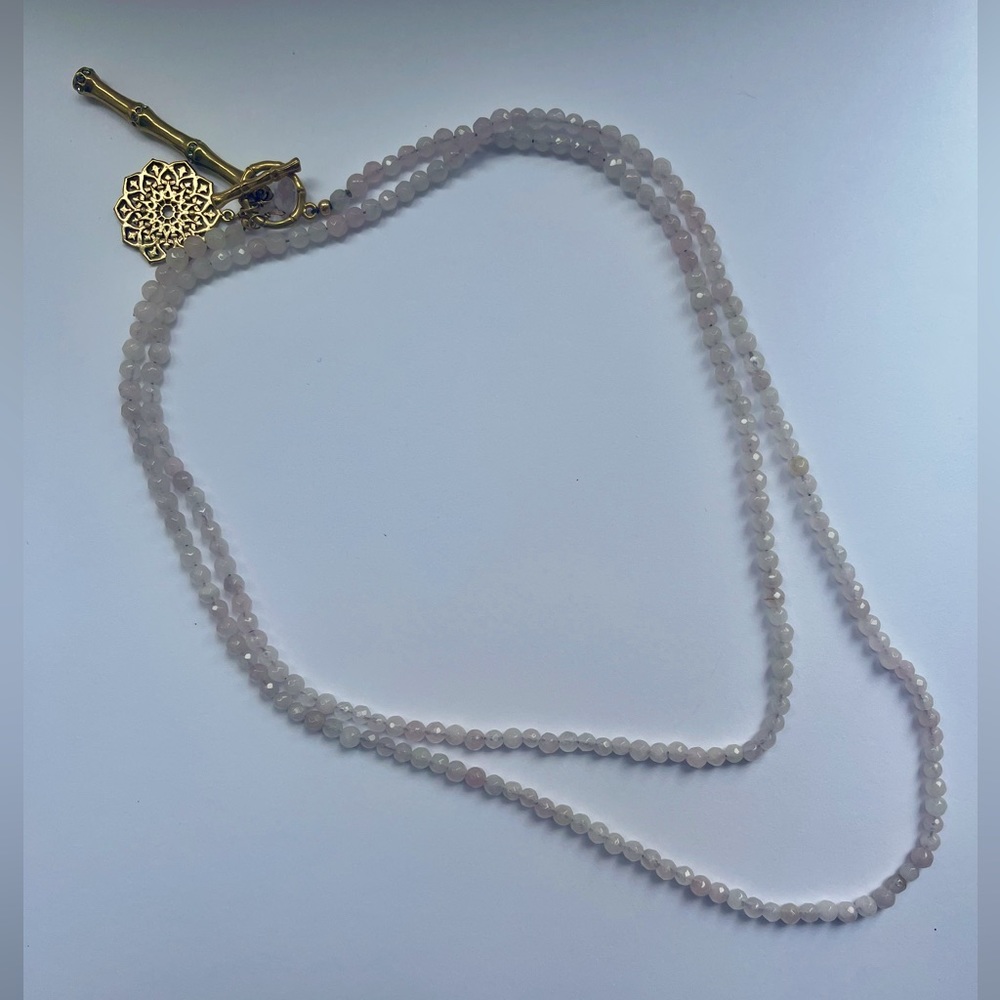 Pale pink beaded long necklace with gold hook as clasp